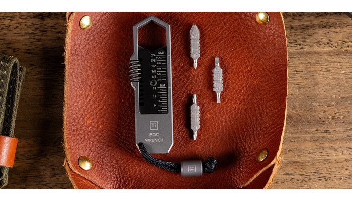 Big Idea Design Ti EDC Wrench with three double-ended driver bits in a leather tray